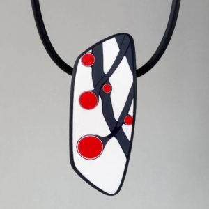 Handmade necklace with a single bead showing a graphic flower bud motif in red, on a white background with a charcoal border. It is approximately 2.6 cm wide and 6.4 cm long and hangs on a black adjustable cord.