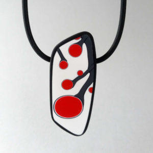 Handmade necklace with a single bead showing a graphic flower bud motif in red, on a white background with a charcoal border. It is approximately 2.6 cm wide and 6.4 cm long and hangs on a black adjustable cord.