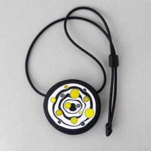 Large handmade pendant with organically-shaped concentric black and white circles, and irregular dots of bright yellow. It is approximately 6.6cm in diameter and hangs on a black adjustable cord.