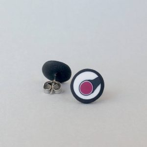 Handmade stud earrings with asymmetrical abstract flower bud pattern in plum tones, on a white background with a charcoal border. Surgical stainless steel posts.