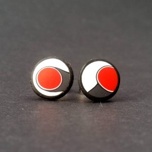 Handmade stud earrings with asymmetrical abstract flower bud pattern in red, on a white background with a charcoal border. Surgical stainless steel posts.