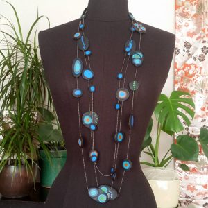Handmade long necklace with individually crafted beads in fresh blues and greens. Inspired by peacock feathers. Necklace length approx. 120cm
