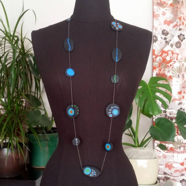 Handmade long necklace with individually crafted beads in fresh blues and greens. Inspired by peacock feathers. Necklace length approx. 120cm.