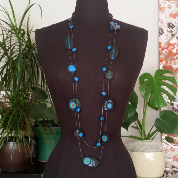 Handmade long necklace with individually crafted beads in fresh blues and greens. Inspired by peacock feathers. Necklace length approx. 120cm