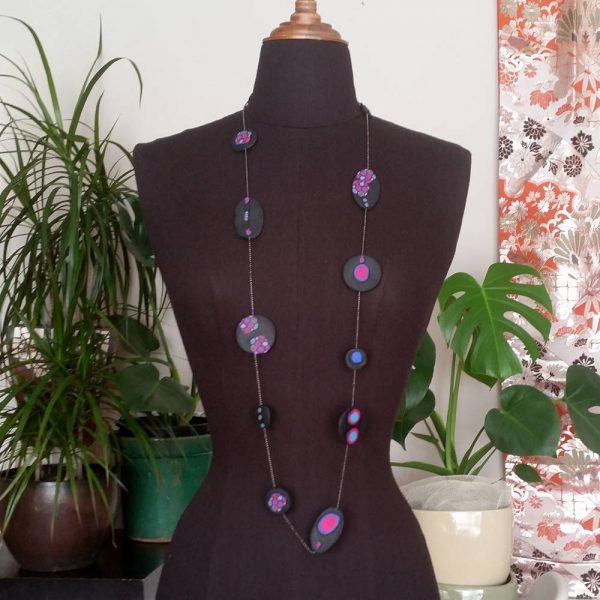 Handmade long necklace (120cm) with individually crafted organically shaped beads in a vivid combination of purple and magenta dots.
