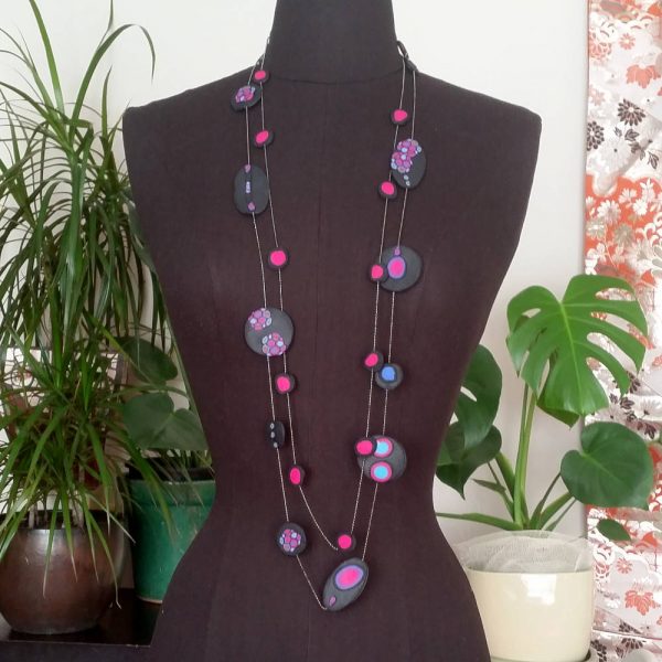 Handmade long necklace (120cm) with individually crafted organically shaped beads in a vivid combination of purple and magenta dots.