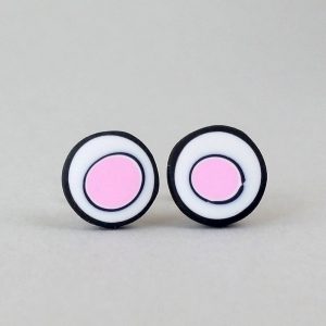 Handmade stud earrings with organic circles of pale pink on a white background with a black border.