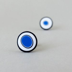 Handmade stud earrings with organic circles of cobalt blue on a white background with a black border.