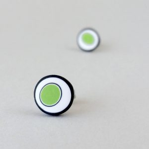 Handmade stud earrings with organic circles of lime green on a white background with a black border.