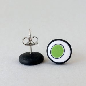 Handmade stud earrings with organic circles of lime green on a white background with a black border.