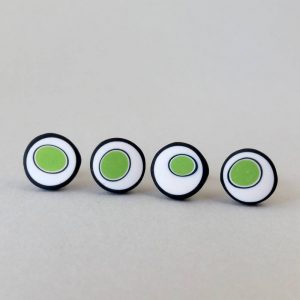 Handmade stud earrings with organic circles of lime green on a white background with a black border.