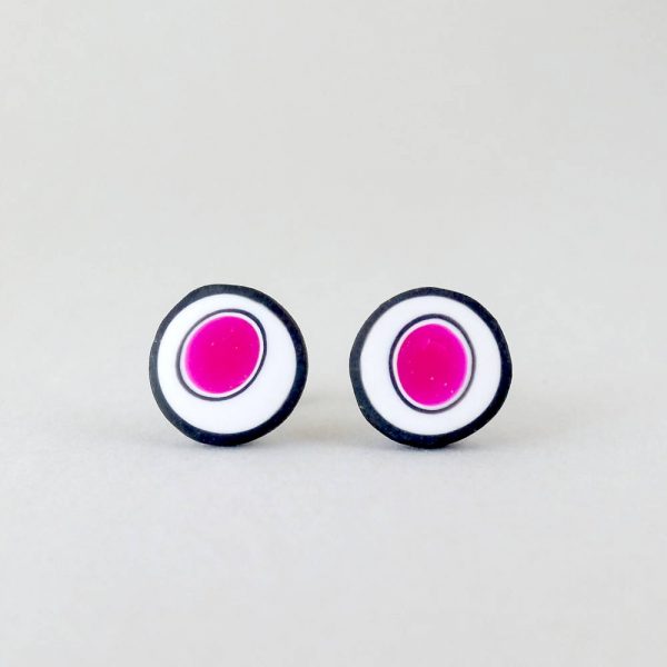 Handmade stud earrings with organic circles of magenta on a white background with a black border.
