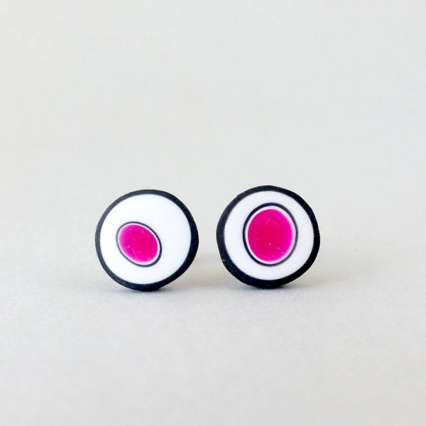 Handmade stud earrings with organic circles of magenta on a white background with a black border.