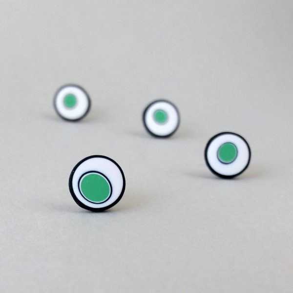 Handmade stud earrings with organic circles of mint green on a white background with a black border.