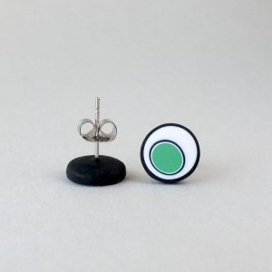 Handmade stud earrings with organic circles of mint green on a white background with a black border.