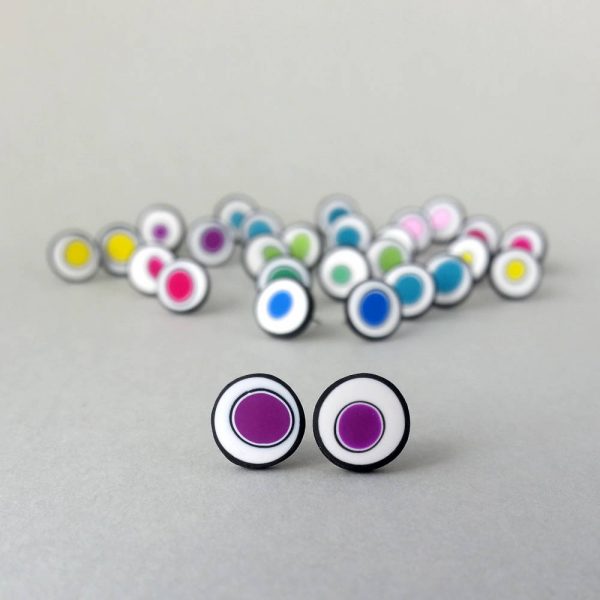 Handmade stud earrings with organic circles of purple on a white background with a black border.