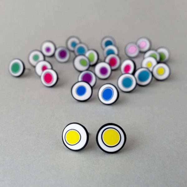 Handmade stud earrings with organic circles of bright yellow on a white background with a black border.