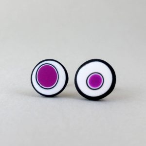 Handmade stud earrings with organic circles of purple on a white background with a black border.