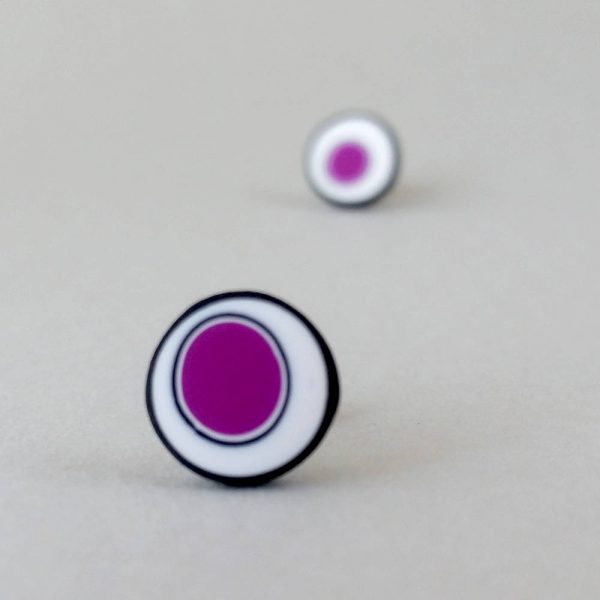 Handmade stud earrings with organic circles of purple on a white background with a black border.