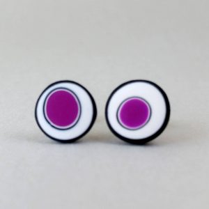 Handmade stud earrings with organic circles of purple on a white background with a black border.