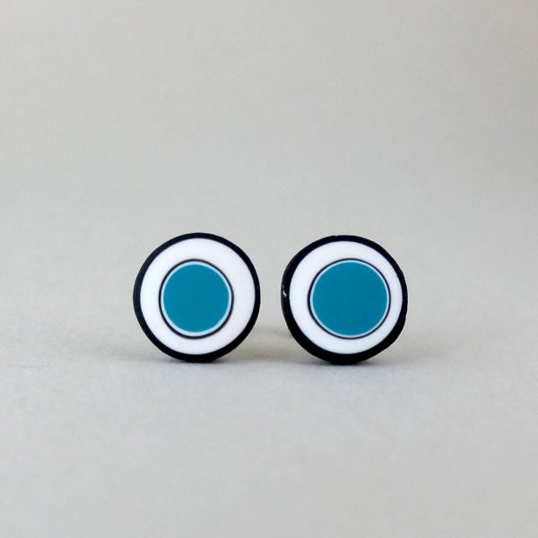 Handmade stud earrings with organic circles of teal blue on a white background with a black border.