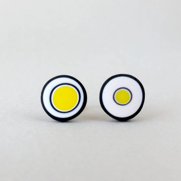 Handmade stud earrings with organic circles of bright yellow on a white background with a black border.