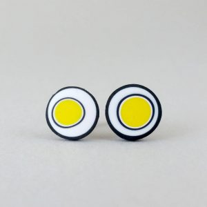 Handmade stud earrings with organic circles of bright yellow on a white background with a black border.