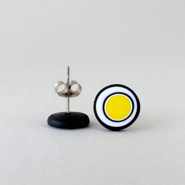 Handmade stud earrings with organic circles of bright yellow on a white background with a black border.