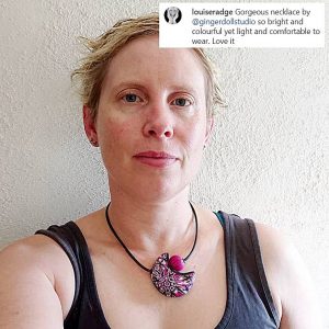 Photo and testimonial for handmade necklace in magenta.