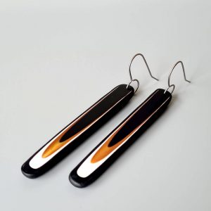 Handmade long dangle earrings with a clean, modern pattern in black, gold and white. Hand crafted titanium earwires.