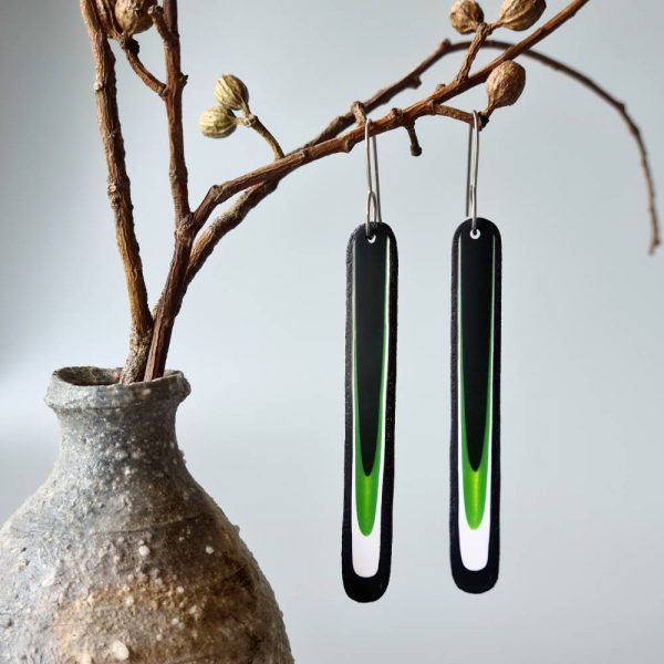 Handmade long dangle earrings with a clean, modern pattern in black, lime green and white. Hand crafted titanium earwires.