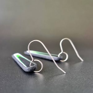 Handmade long dangle earrings with a clean, modern pattern in black, lime green and white. Hand crafted titanium earwires.