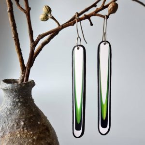 Handmade long dangle earrings with a clean, modern pattern in black, lime green and white. Hand crafted titanium earwires.