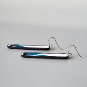 Handmade long dangle earrings with a clean, modern pattern in black, teal blue and white. Hand crafted titanium earwires.