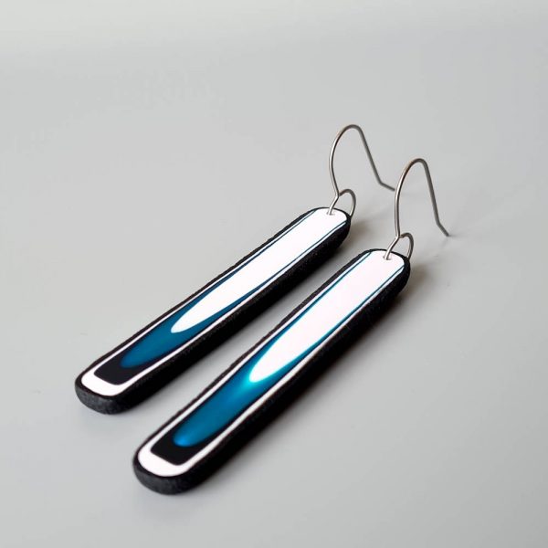 Handmade long dangle earrings with a clean, modern pattern in black, teal blue and white. Hand crafted titanium earwires
