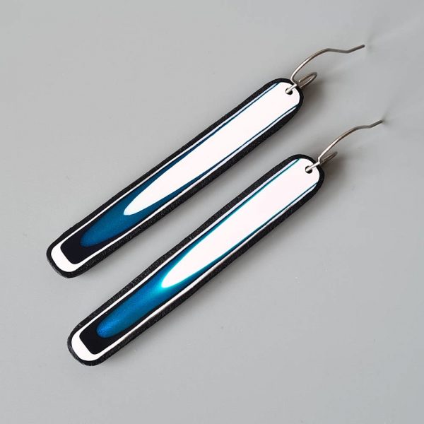 Handmade long dangle earrings with a clean, modern pattern in black, teal blue and white. Hand crafted titanium earwires