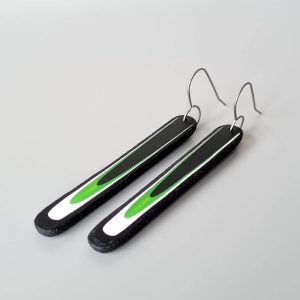 Handmade long dangle earrings with a clean, modern pattern in black, lime green and white. Hand crafted titanium earwires.