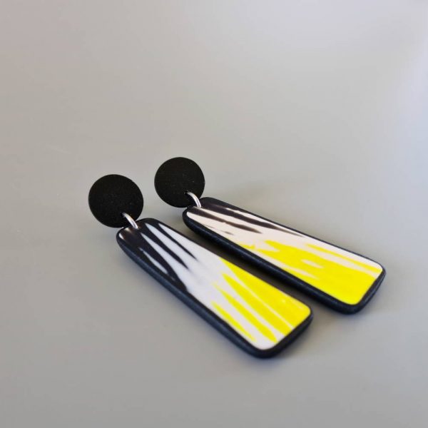 Handmade dangle earrings with zigzag pattern in black, white and sunshine yellow.