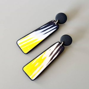 Handmade dangle earrings with zigzag pattern in black, white and sunshine yellow.