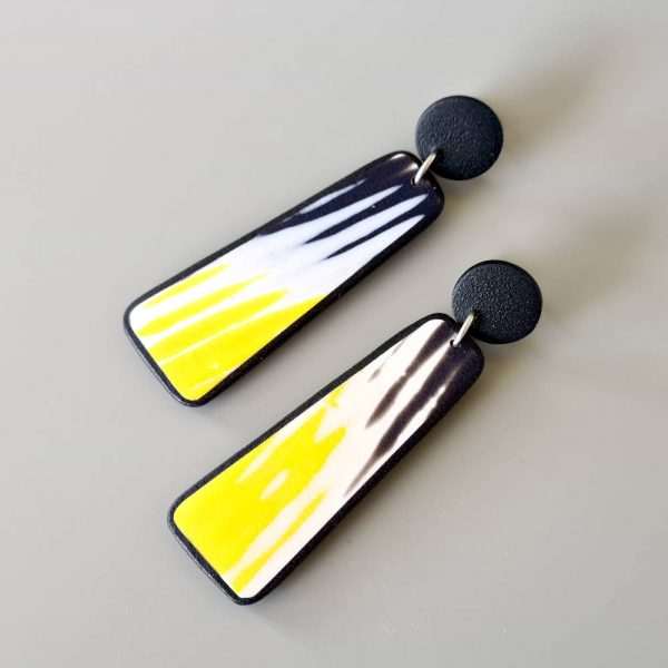 Handmade dangle earrings with zigzag pattern in black, white and sunshine yellow.